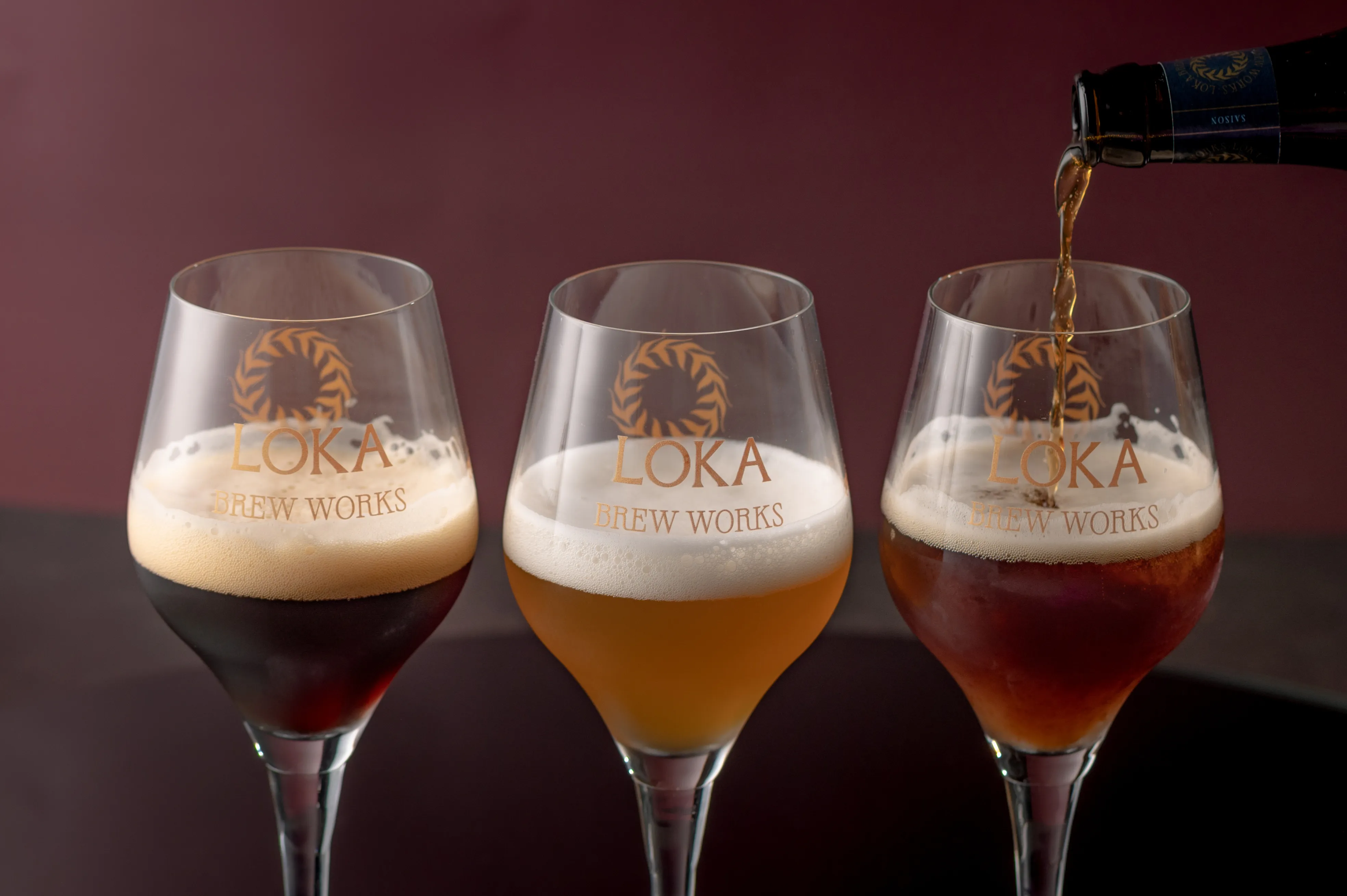 Three Loka Brew Works glasses being poured